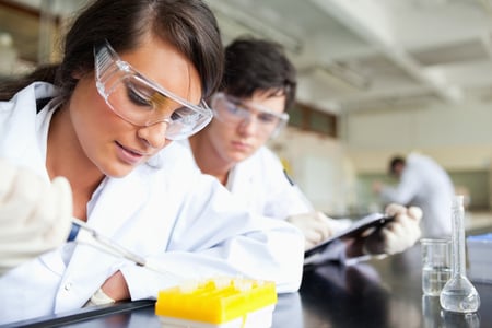 Two young scientists making an experiment in a laboratory-1